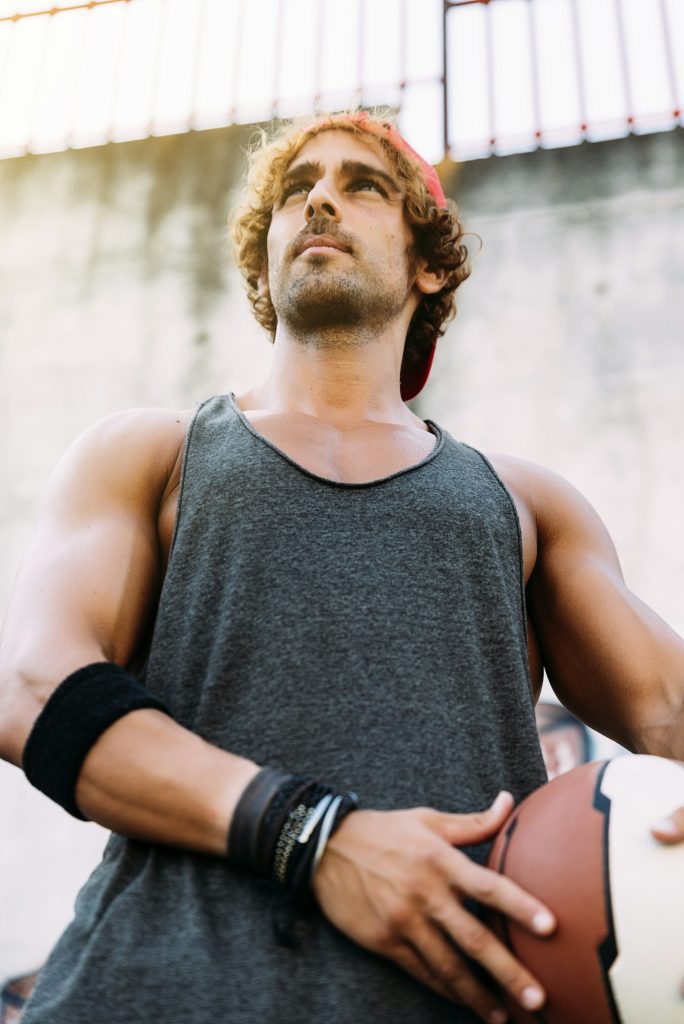 Man with Casual Sport wear and basket ball.